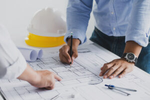 Architects and engineers from Architecture Firm working on a blueprint