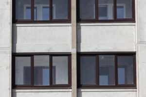 An exterior view of a newly constructed building in a residential area designed by a multi-family architect