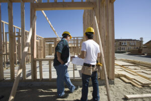 Two male architects are planning for the next multi-family housing projects